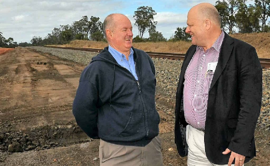 Banana Shire Mayor John Hooper and Origin project manager for pipelines Graeme Hogarth discuss the site of the new rail siding. Banana Shire Mayor John Hooper and Origin project manager for pipelines Graeme Hogarth discuss the site of the new rail siding.